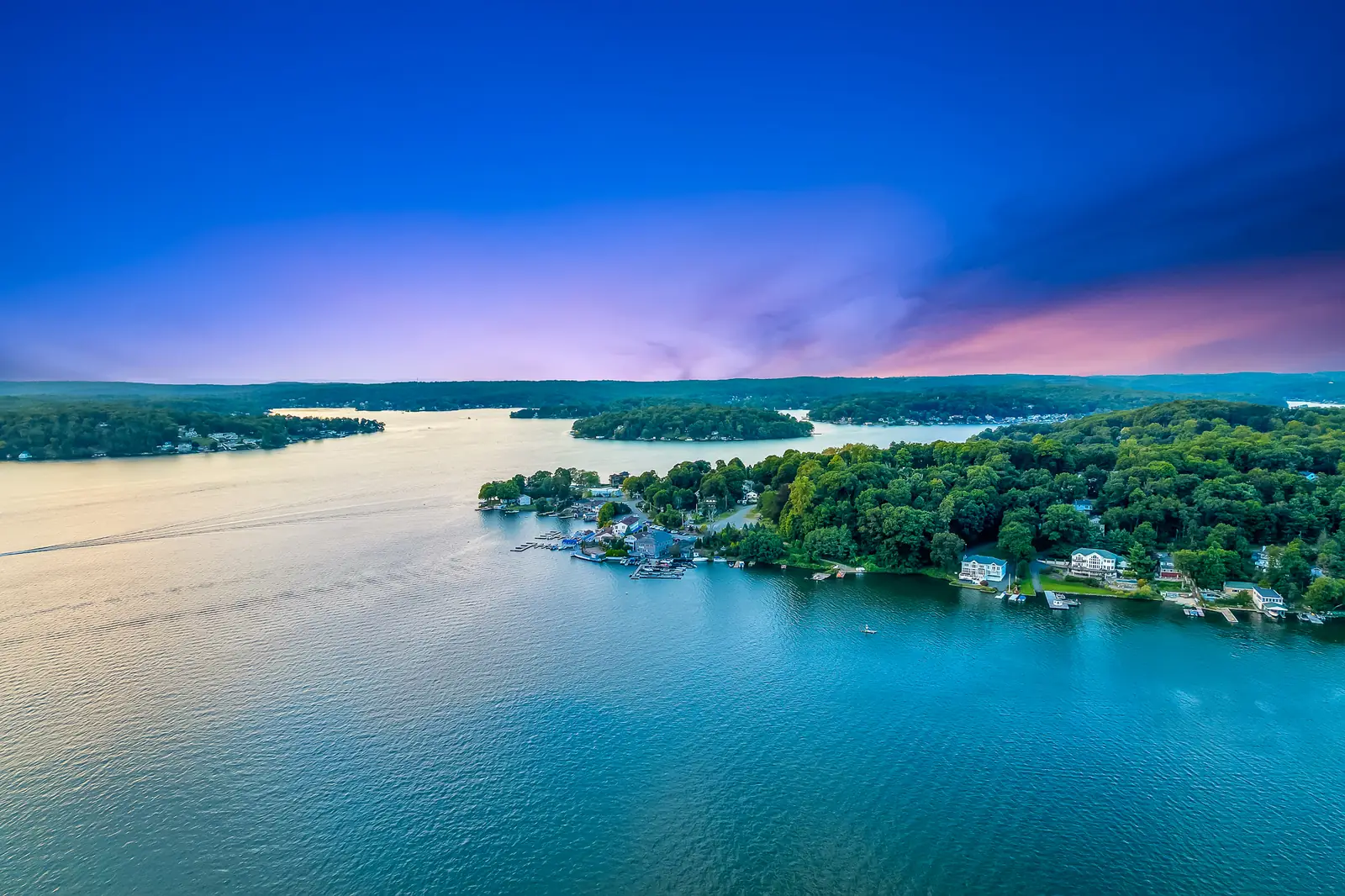 Lake Hopatcong from the air, a wooded point and islands running out into the water